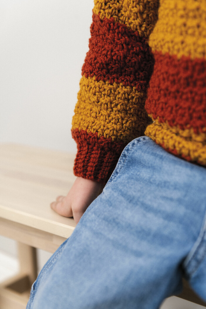 The jacket has a simple balloon sleeve. Crochet baby sweater with balloon sleeves.