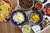 Uppdukat för tacoafton. Majsen, osten och den heliga gurkan.