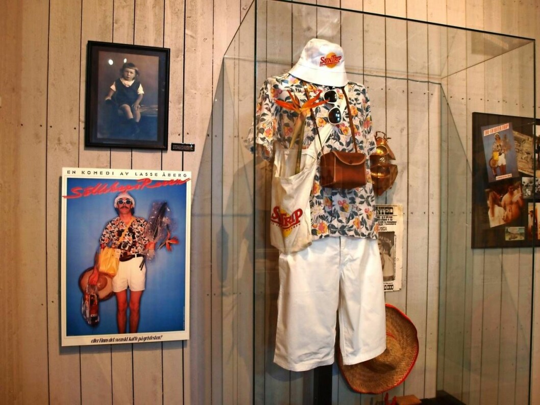 Vem minns inte Lasse Åbergs filmer om den motvillige semesterresenären Stig-Helmer? På Åbergs museum i Bålsta finns även Trazans koja, serier och Disneyfigurer. Delar av utställningen på Åbergs museum i Bålsta