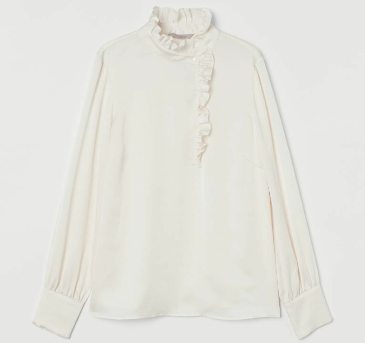 Blus med volang i kronprinsessans stil.