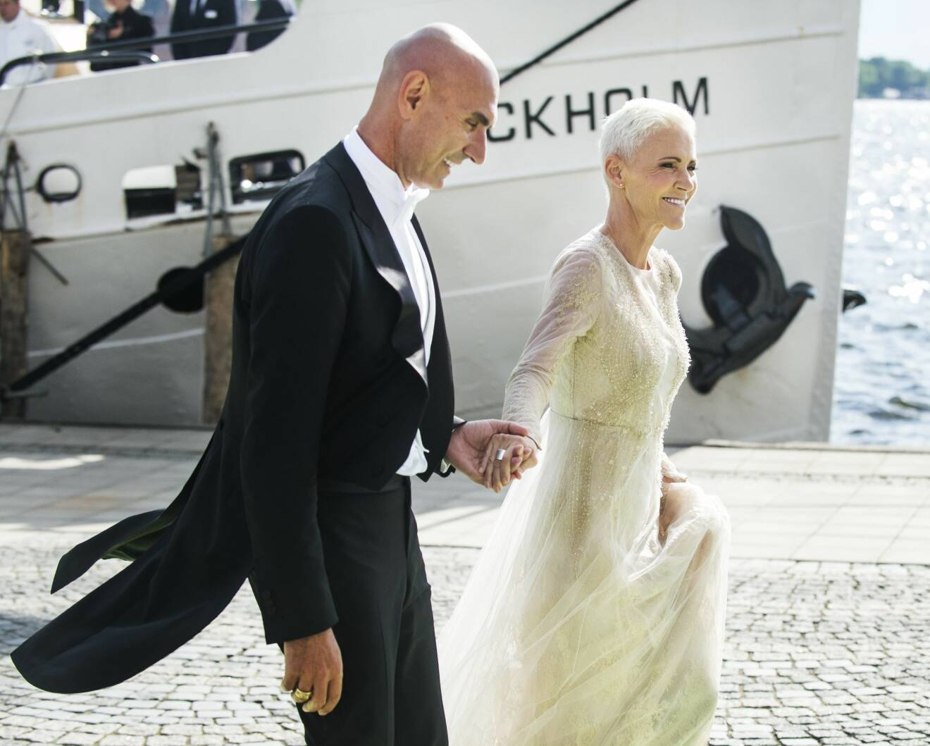 Marie Fredriksson tillsammans med maken Mikael Bolyos i samband med prinsessan Madeleines och Chris O'Neills bröllop 2013 i Stockholm.