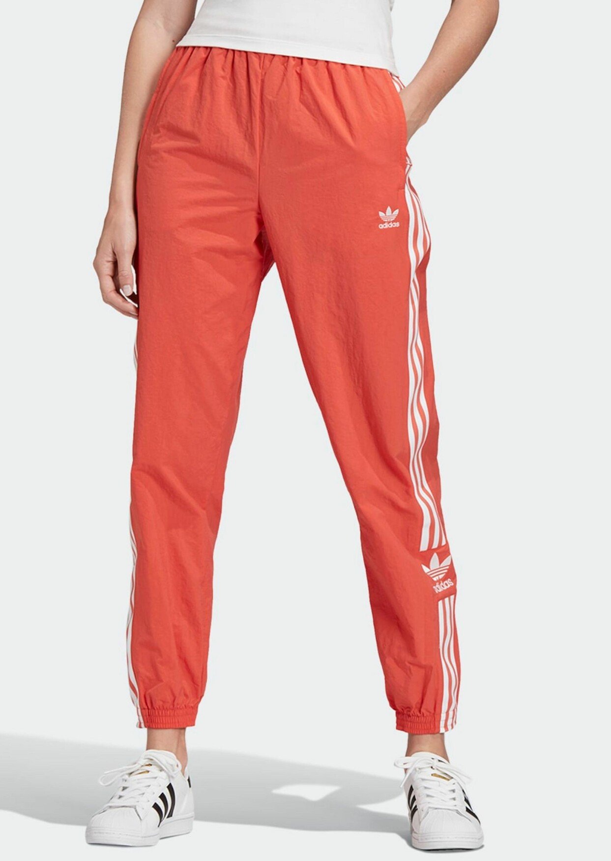 Orange träningsbyxor från Adidas Originals