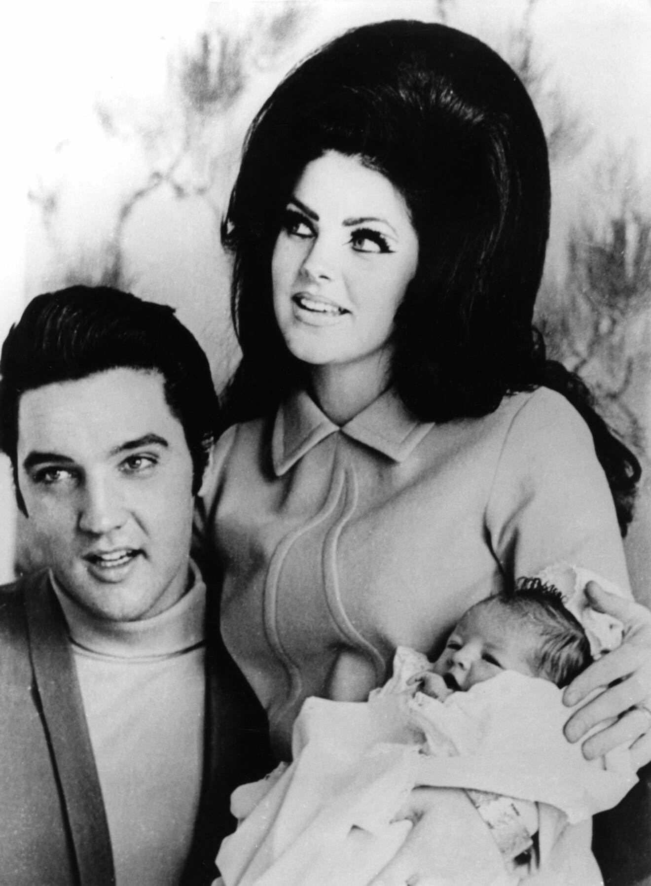 Lisa Marie Presley med sina föräldrar.