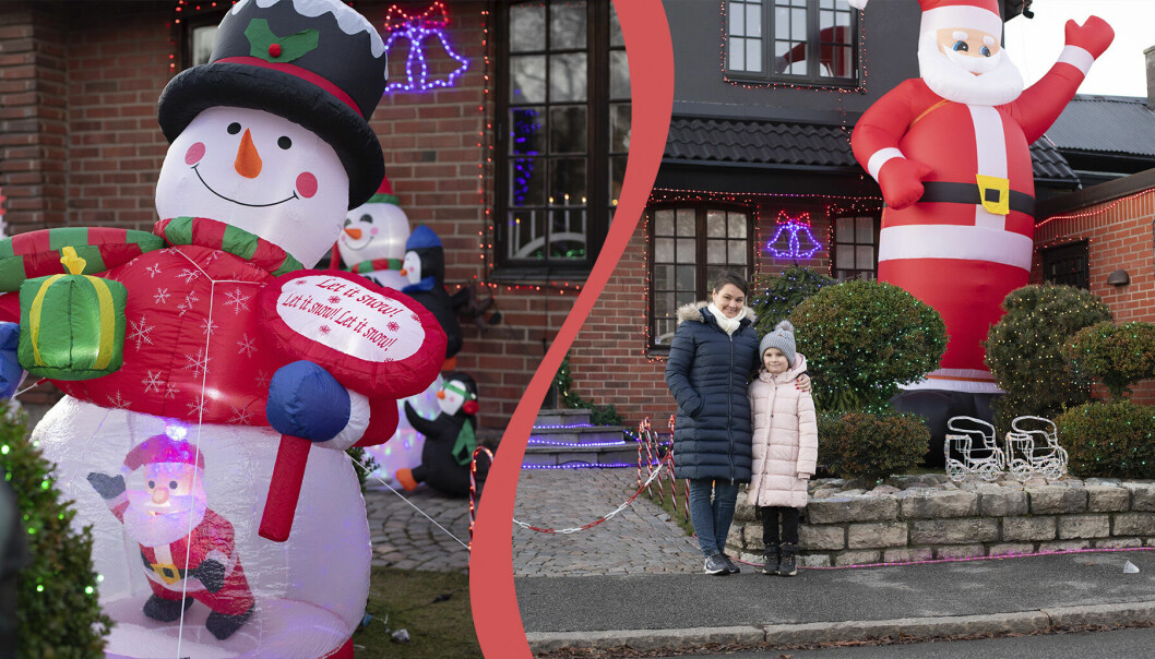 Snögubbe och jultomte som dekorerar ett hus i Malmö.
