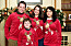 Fyra personer i jultröjor med älgar på.
