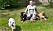 Martina tillsammans med några av sina djur på en gräsmatta