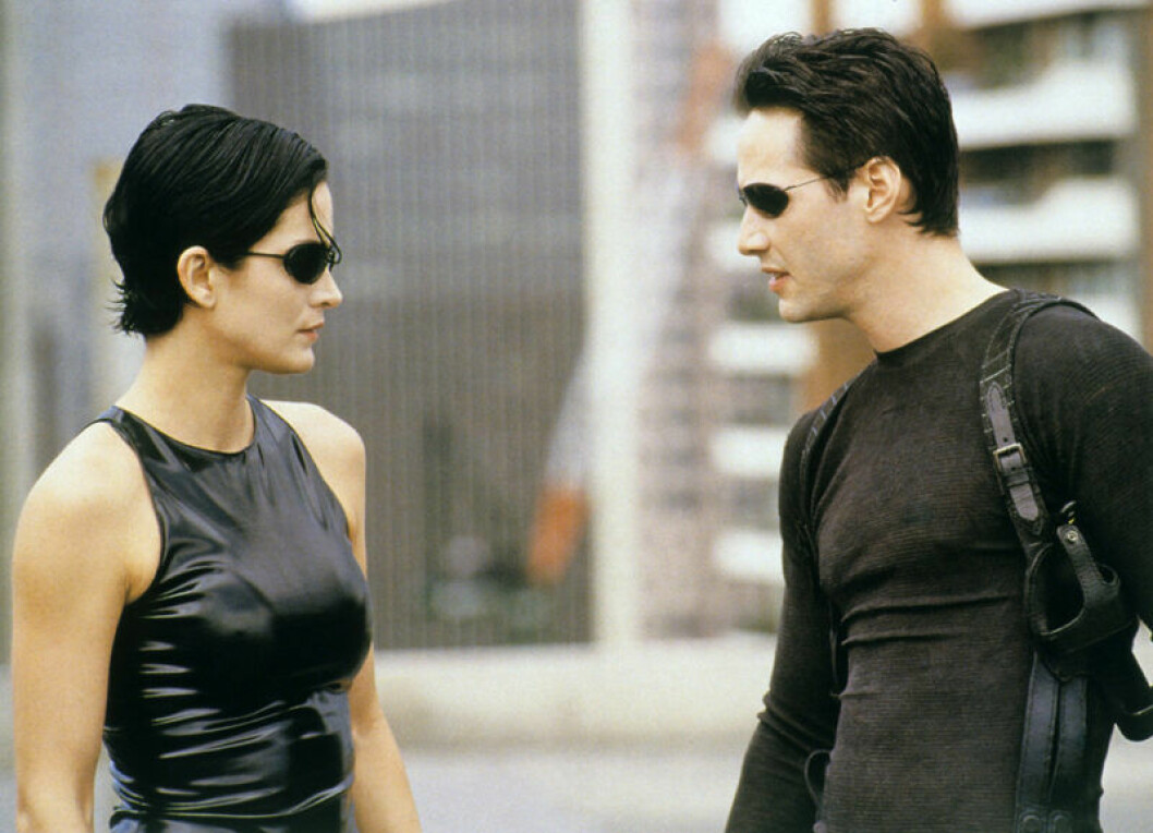 Carrie-Anne Moss och Keanu Reeves i <em>The Matrix</em>. Foto: TT Bild från The Matrix (1999)