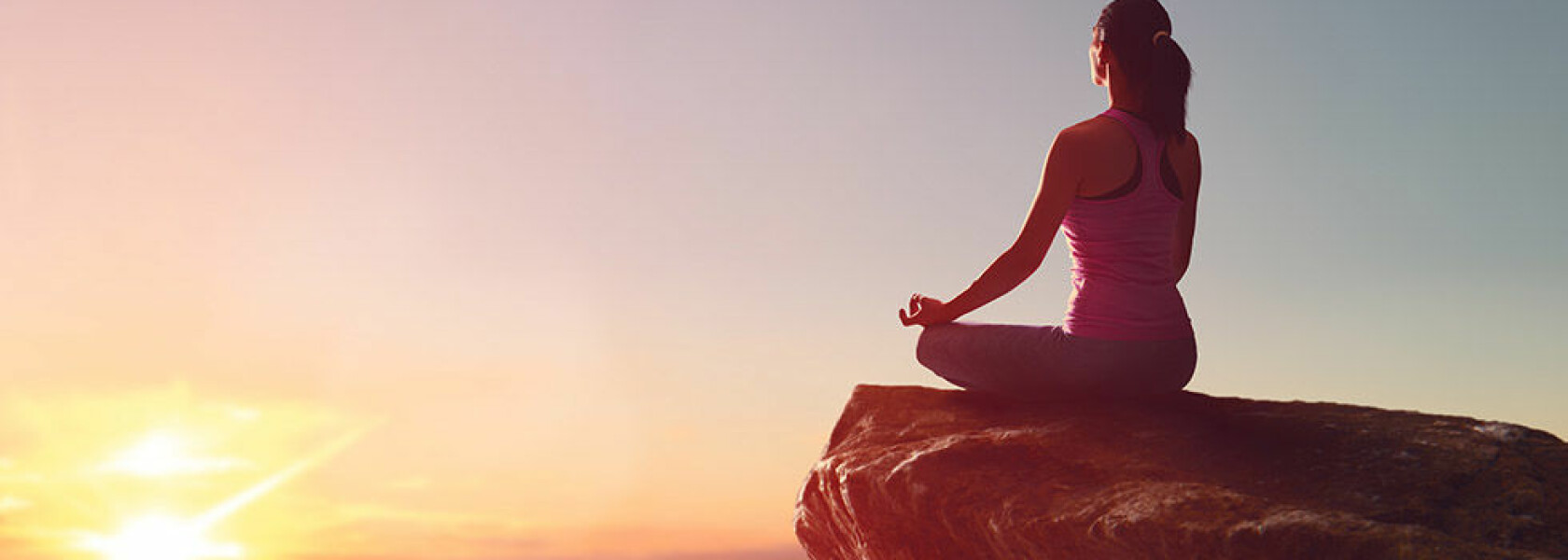 Woman practices yoga and meditates on the mountain.; Shutterstock ID 688367407 Woman practices yoga and meditates on the mountain.; Shutterstock ID 688367407