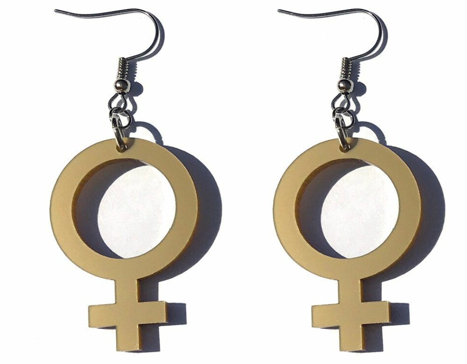 Örhängen feminist med kvinnosymbol.