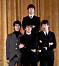 The Beatles 1964 bestod av George Harrison, Ringo Starr, Paul McCartney och John Lennon bakom.