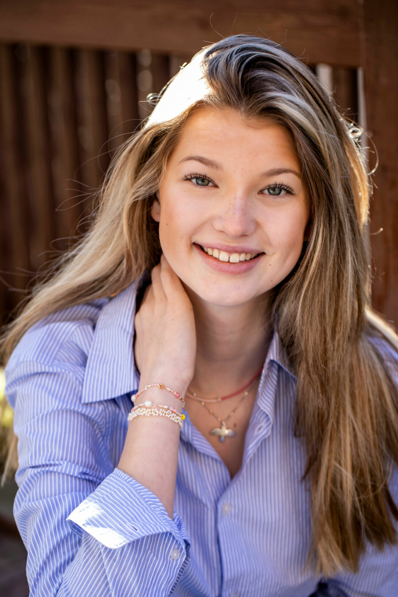Mix and match with your jewelry for a beautiful summer look. Little girl with beaded bracelets
