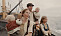 Filmbild på Kristina, Karl Oskar och barnen på segelbåten som ska ta dem till Amerika.